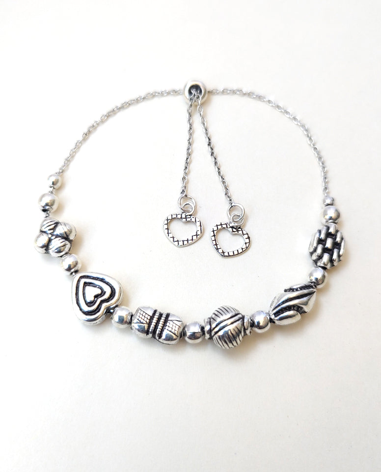 A Dainty Bracelet Made in 925 Sterling Silver With Charming Beads