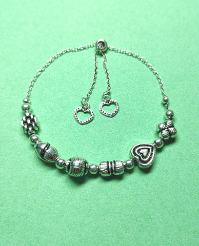 A Dainty Bracelet Made in 925 Sterling Silver With Charming Beads