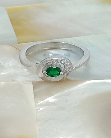 A Beautiful Ring For Trendy Girls in 925 Sterling Silver with Beautiful Cubic Zircon Stones And A Round Cut Pretty Green Stone in Center