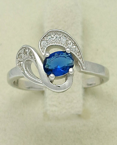An Elegant Design Ring in Authentic 925 Sterling Silver With An Alluring Blue Center Stone